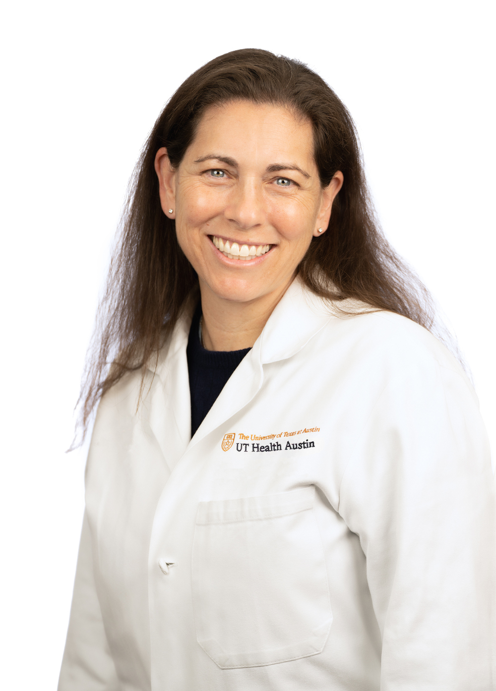 Dr. Erin Gottlieb wearing a white coat and smiling in front of a white backdrop.