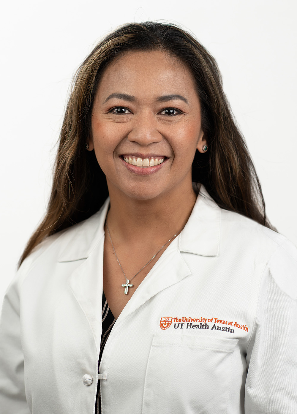 Physician assistant Marie Litschewsi, MPAS, PA-C, wearing a white coat and smiling in front of a white background.
