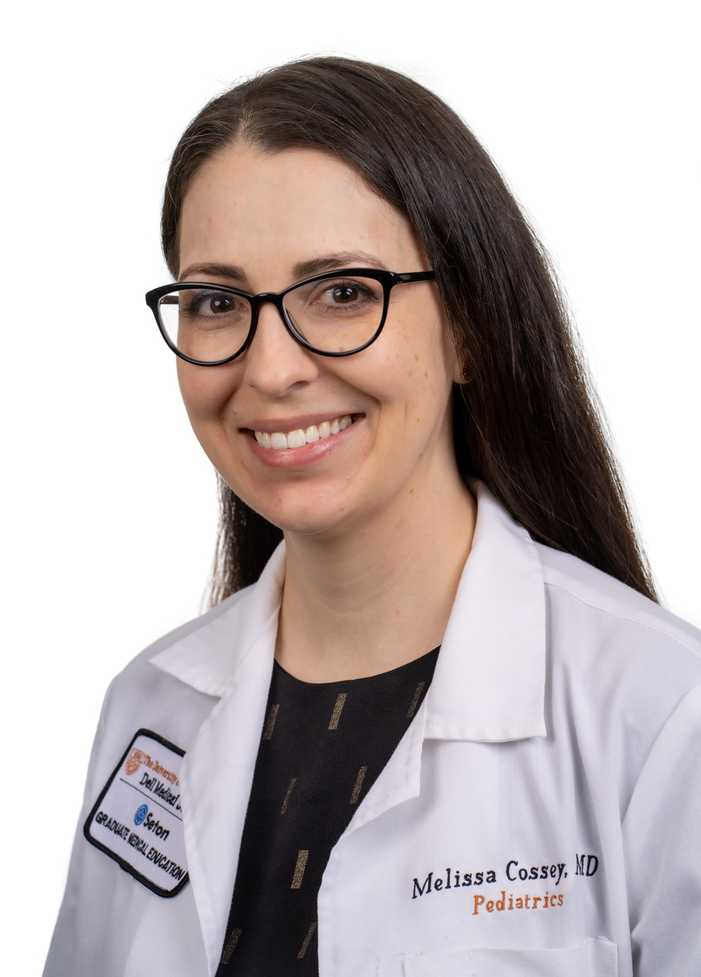 Pediatrician Melissa Cossey, MD, wearing a white coat and smiling in front of a white backdrop.