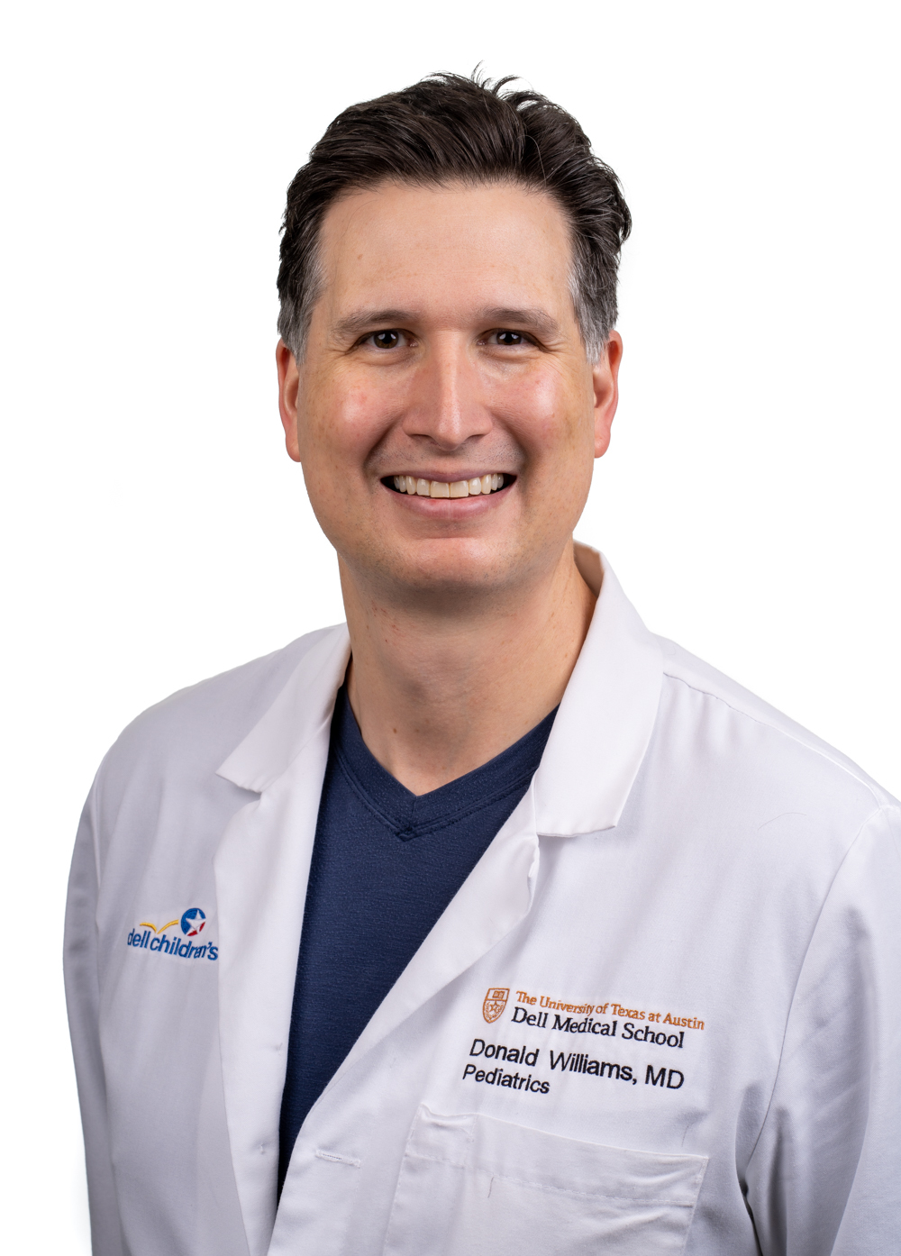 Pediatric hospitalist Donald Williams, MD, wearing a white coat and smiling in front of a white backdrop.